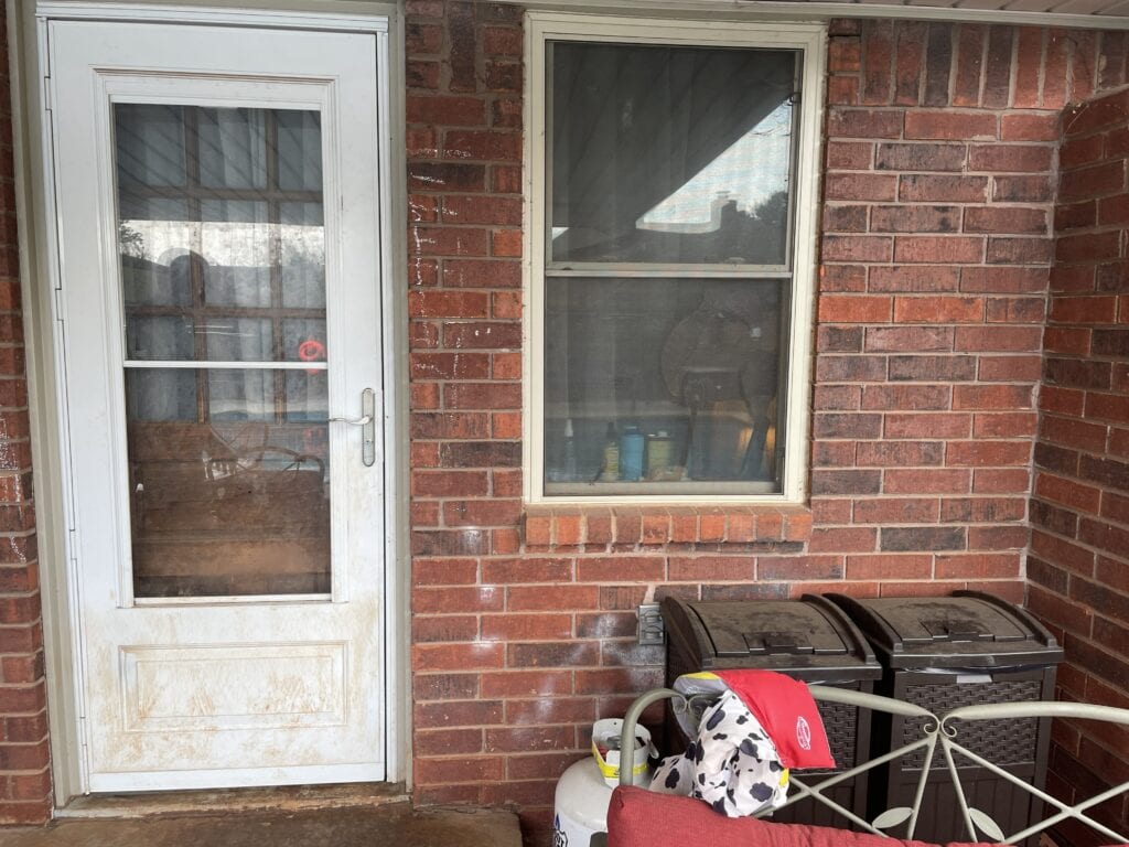 Existing back door and window before patio door replacement in Oklahoma City